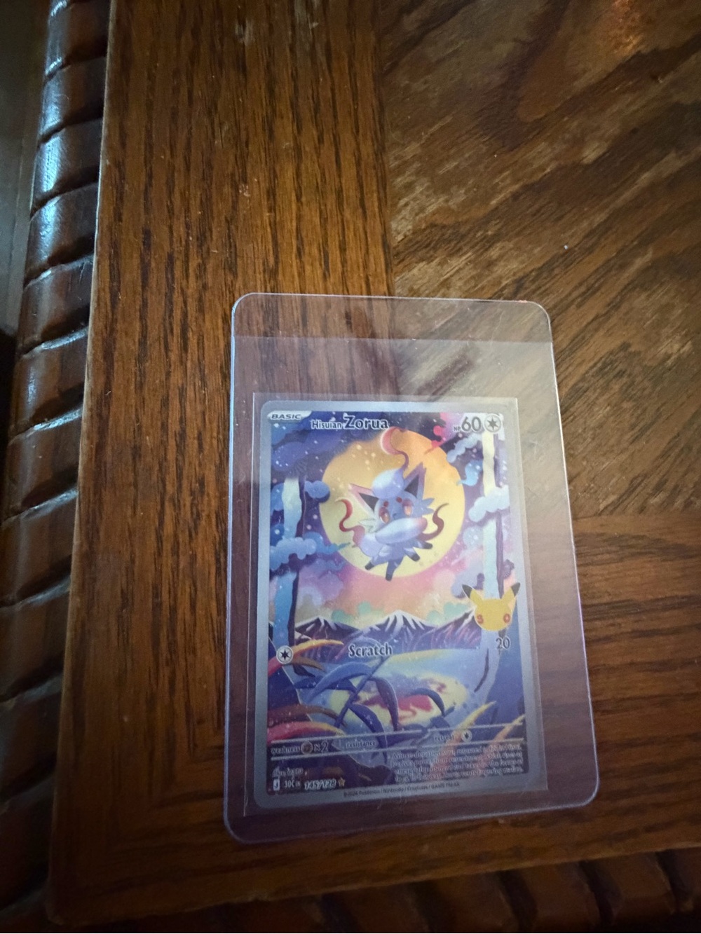 Pokemon Zorua Holographic Card - Purple, Yellow, Blue